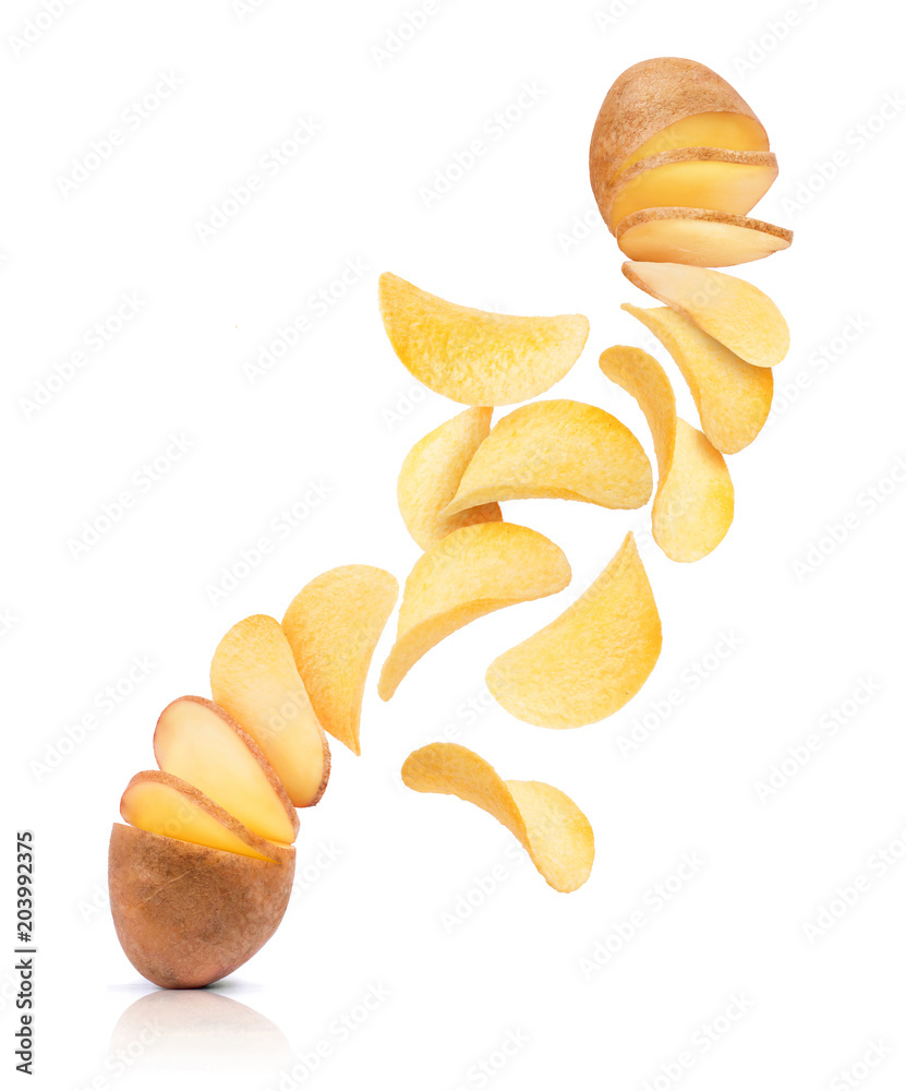 Potato slices turn into chips. Conceptual image on white background