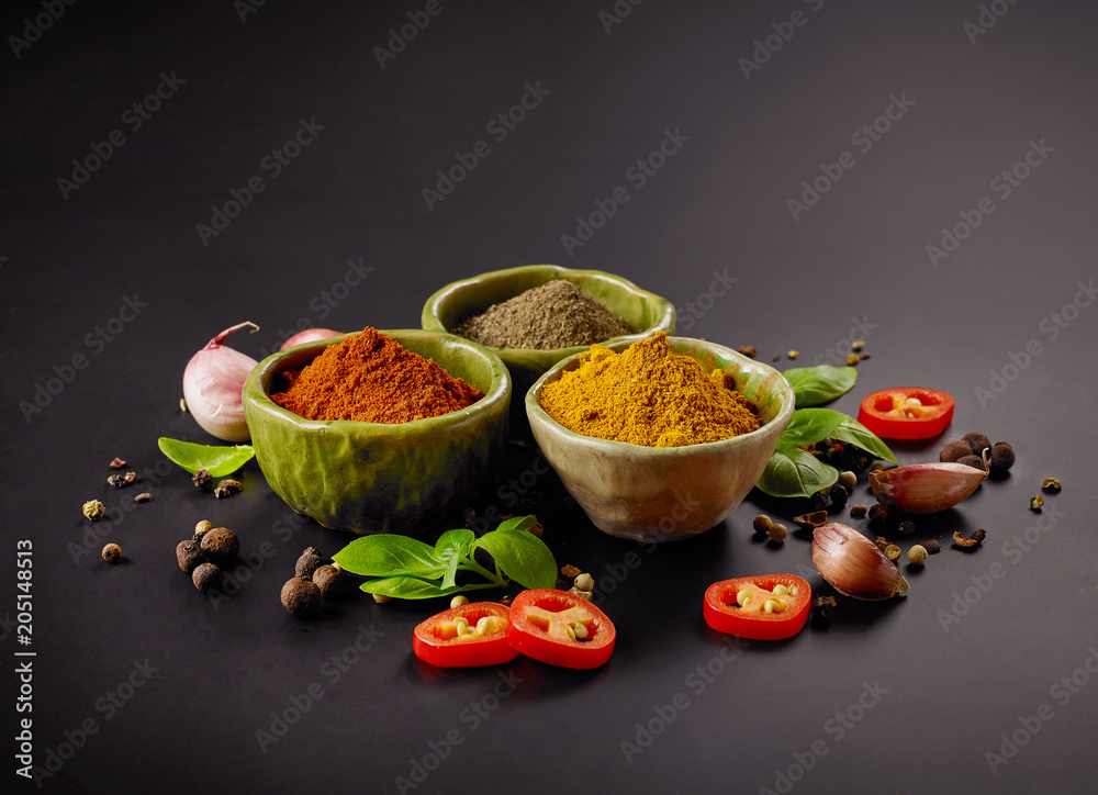 various spices on black background
