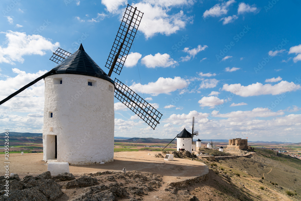Madrid travel destination. Landscape of windmills of Don Quixote. Historical building in Cosuegra ar