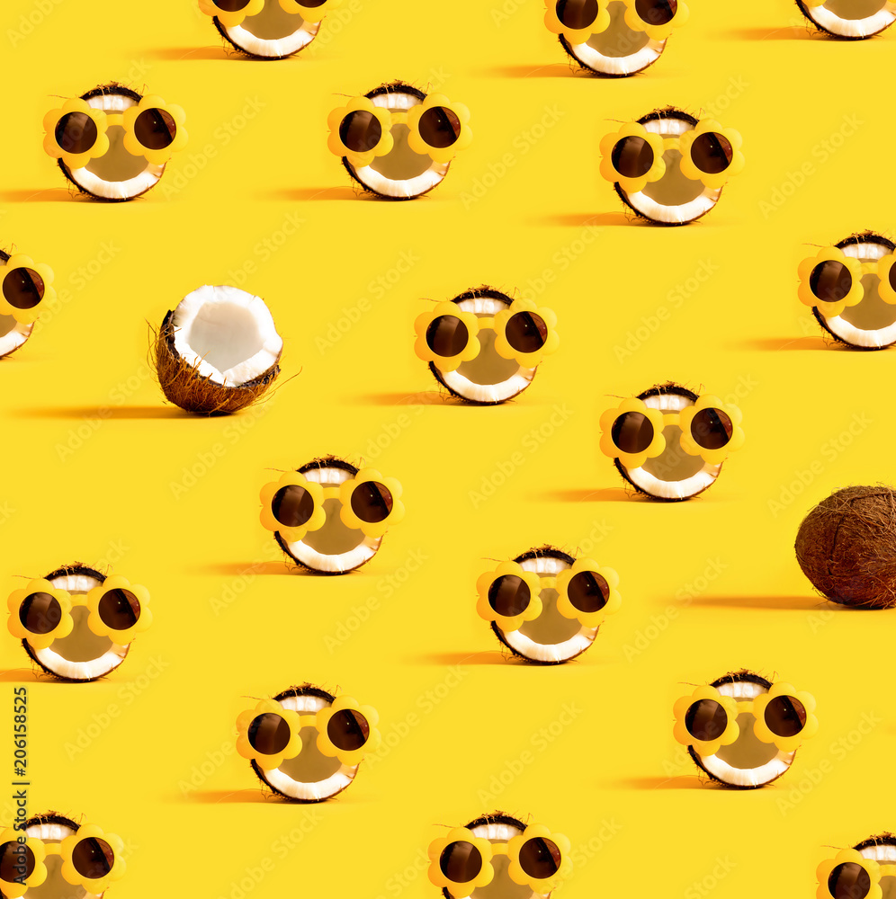 Series of coconuts wearing sunglasses on a yellow background