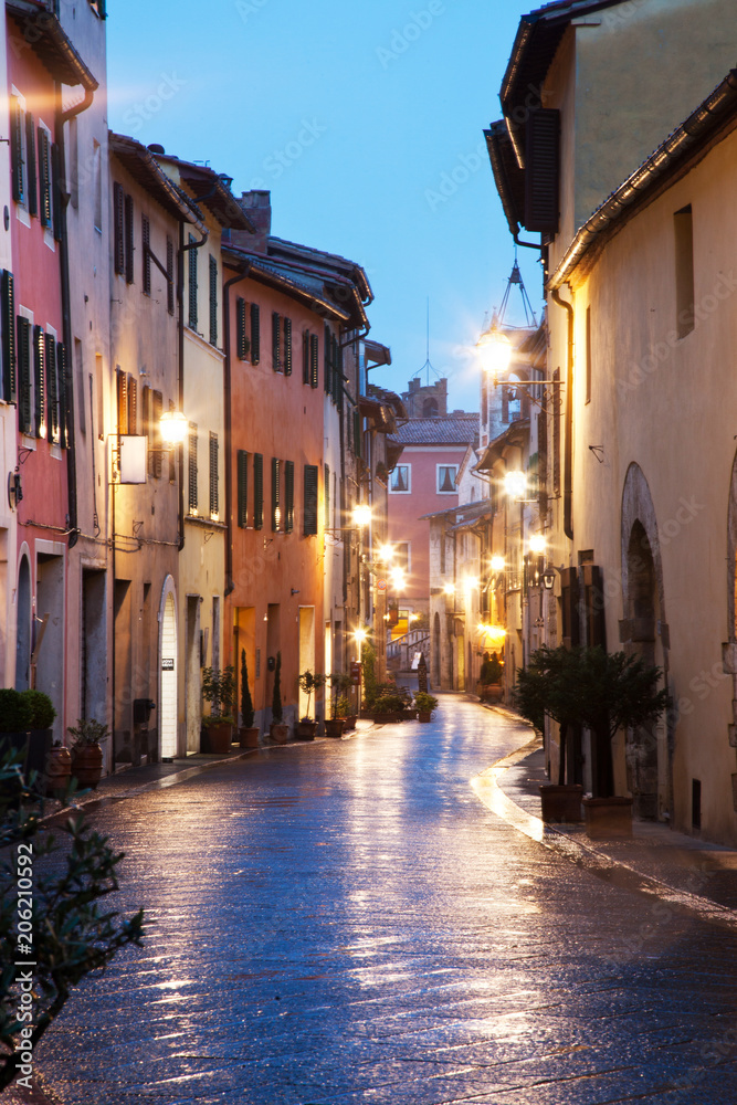 streets at night in San Quirico dOrcia after rain, Tuscany, Italy