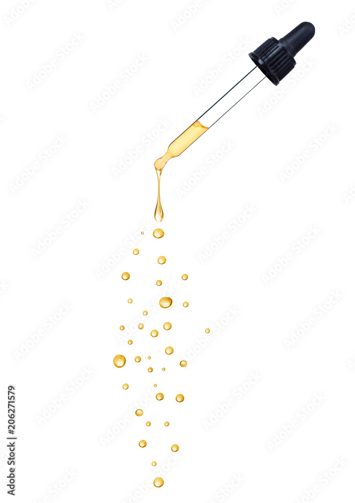 Close-up of dropper with falling drops isolated on white background