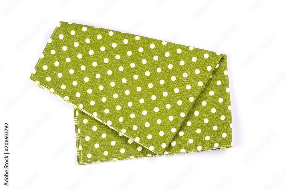 白色背景上的绿色波点格纹餐巾桌布。