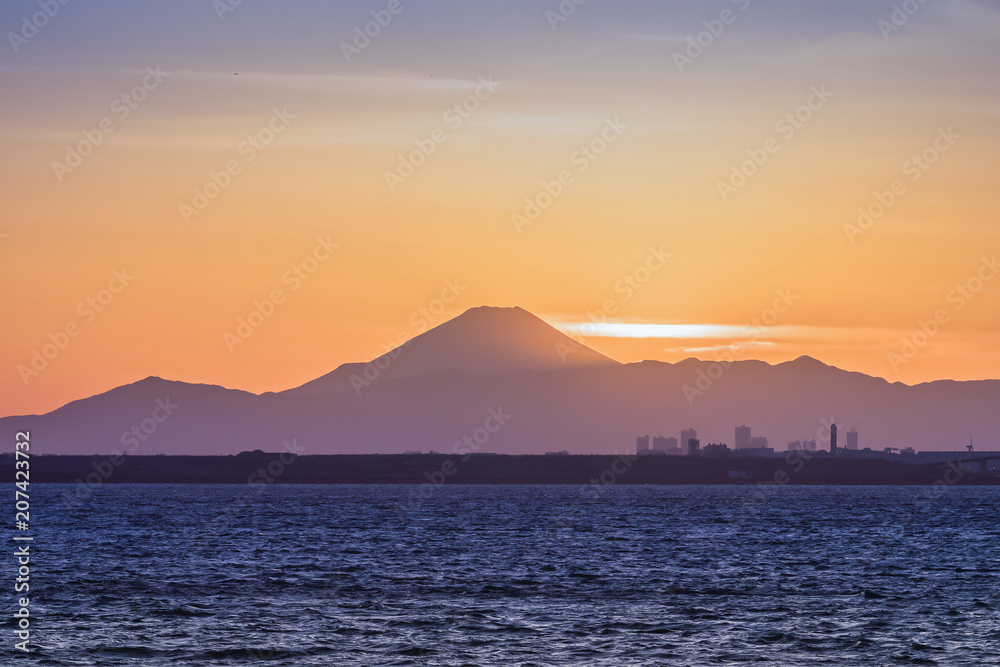 Mountain Fuji and Tokyo bay at sunset time in winter season.Tokyo Bay is a bay located in the southe