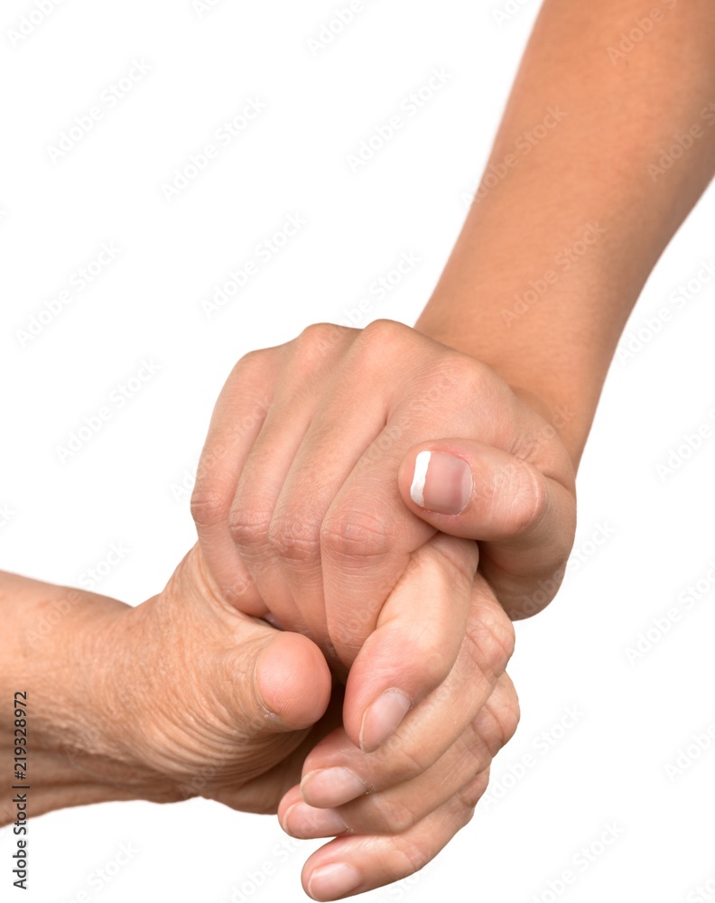 Young Womans Hand Touching and Holding an Old Hand