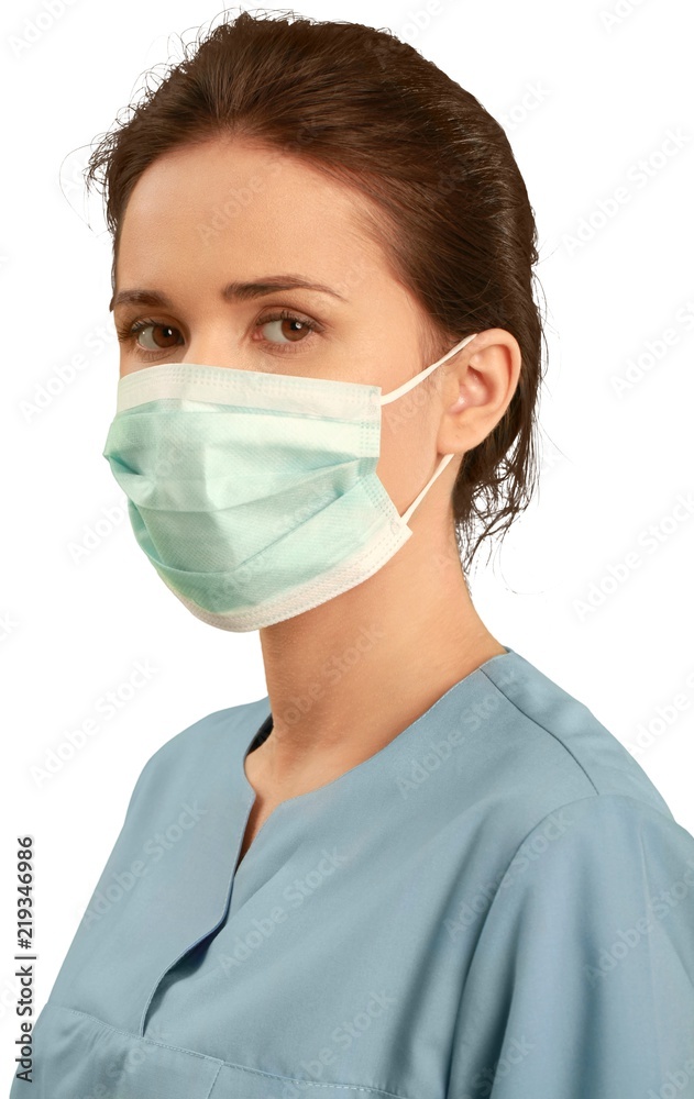 戴着口罩和磨砂膏的女性医护人员