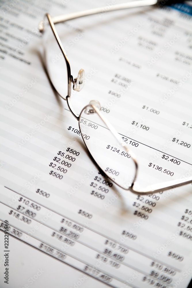 Glasses On Financial Report Close-up