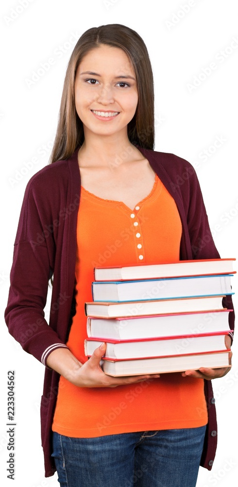 美丽的年轻女学生拿着书