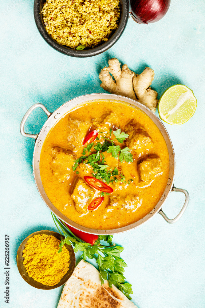 Traditional curry on blue background