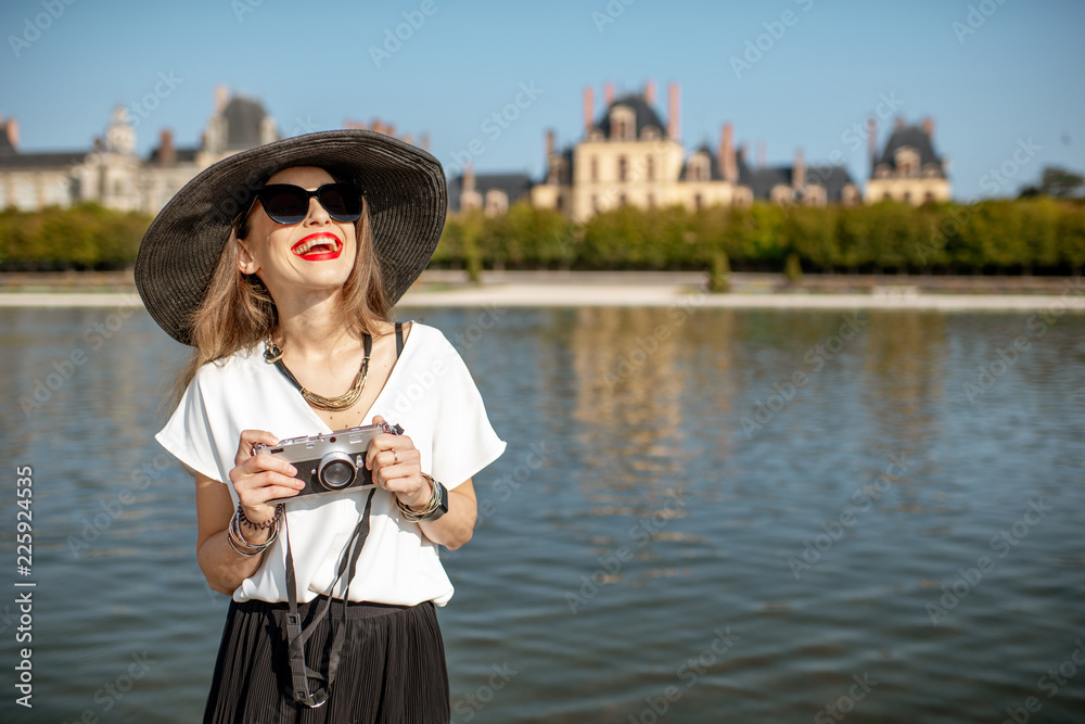 Woman visiting Fontainebleau gardens, France