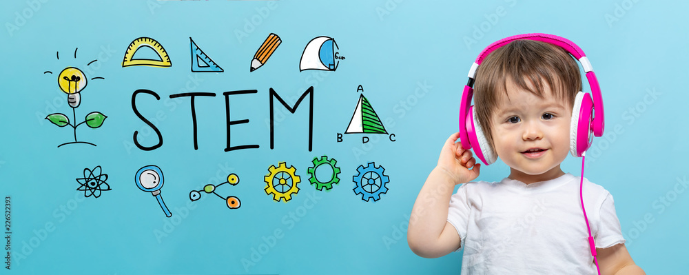 STEM with toddler boy with headphones on a blue background
