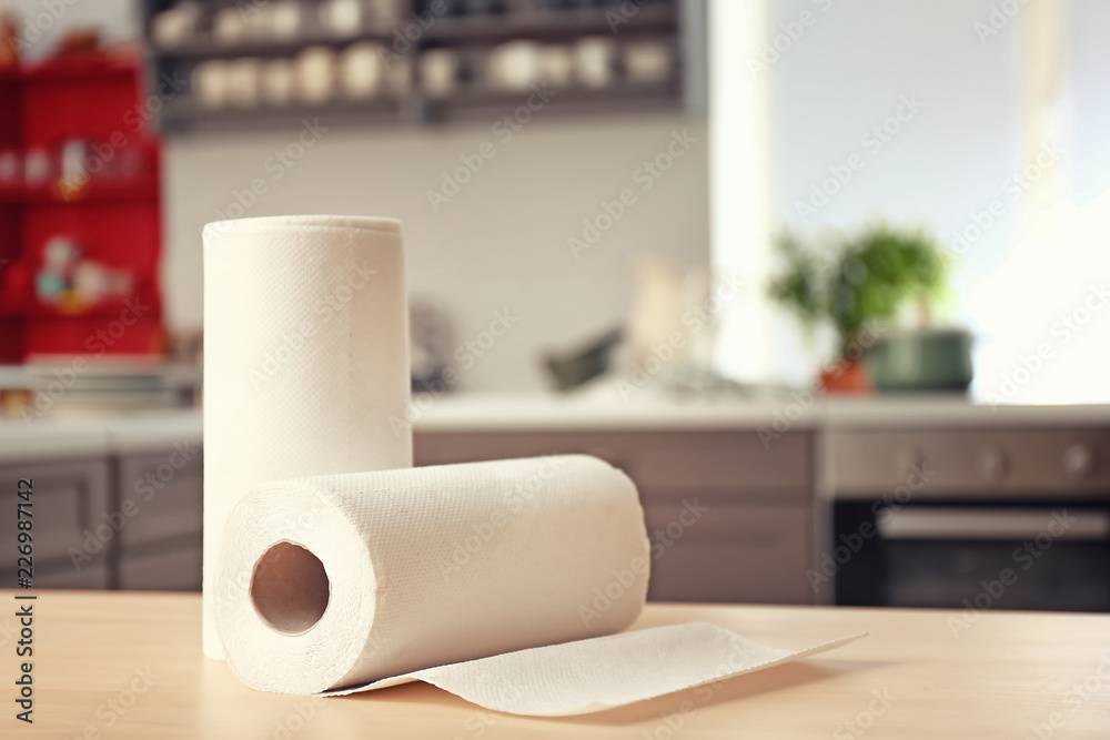 Rolls of paper towels on kitchen table