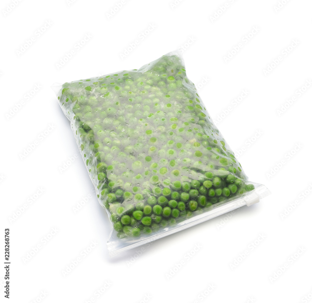 Plastic bag with frozen green peas on white background
