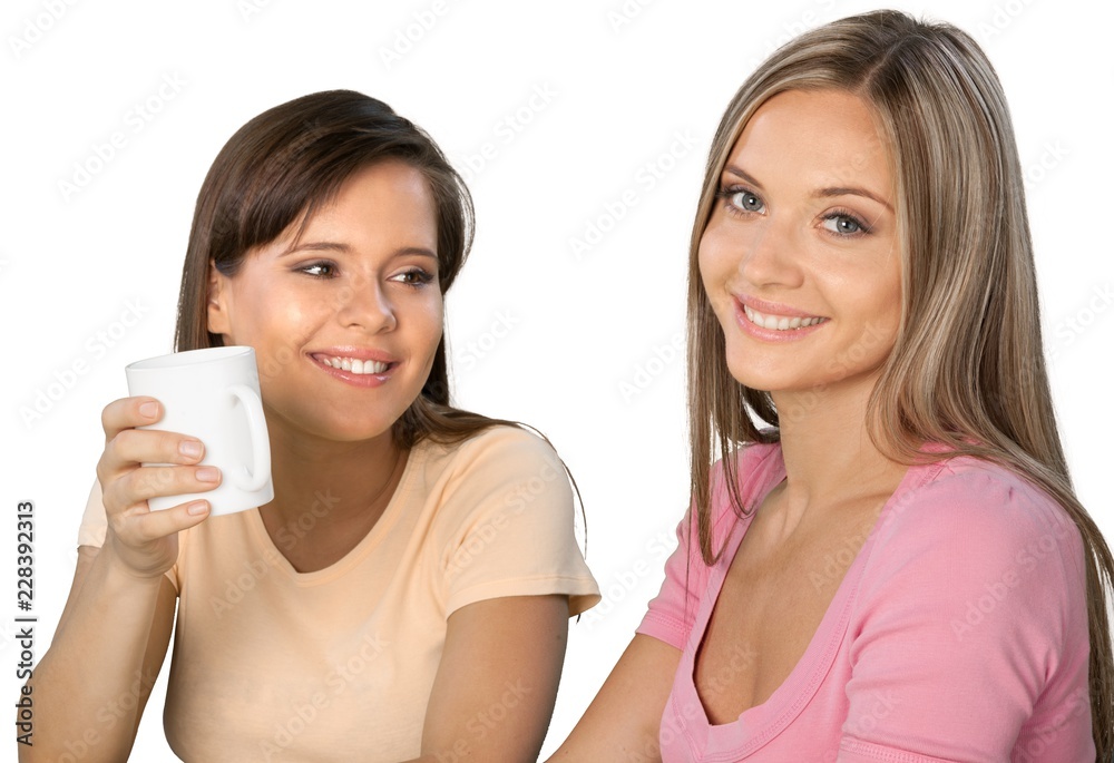 两个女朋友/姐妹喝咖啡的肖像