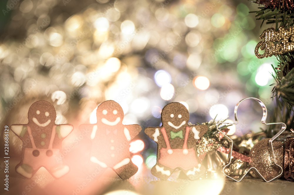 Cute gingerbread man with christmas tree and blurry sparkle background, close up, bokeh, text space(