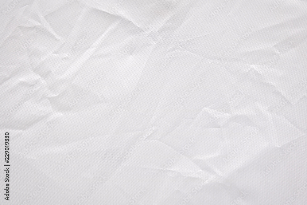 抽象褶皱织物纹理背景。褶皱白色纺织材料图案。