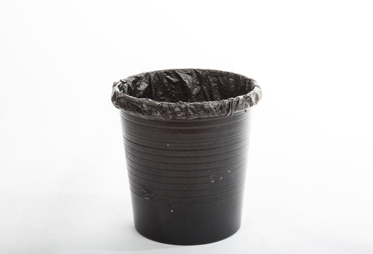 Empty black trash can isolated