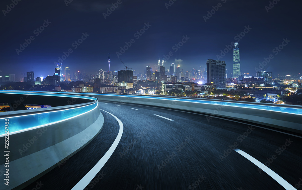 Highway overpass motion blur with city background . night scene .