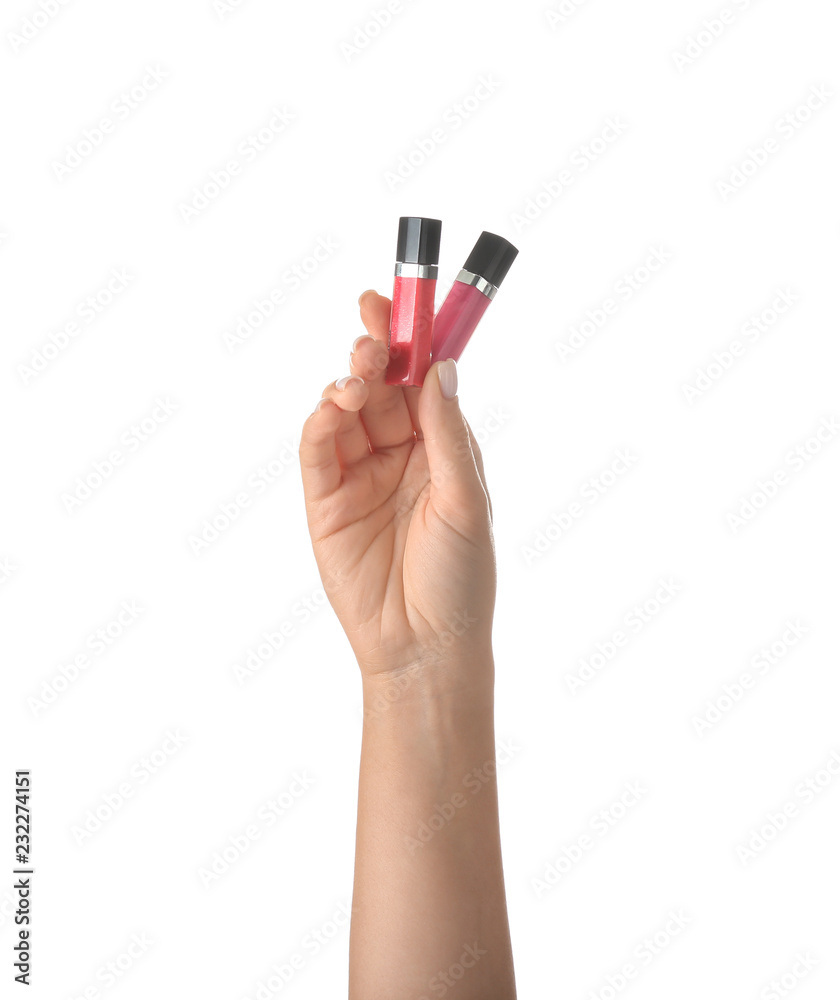 Woman holding lip glosses on white background