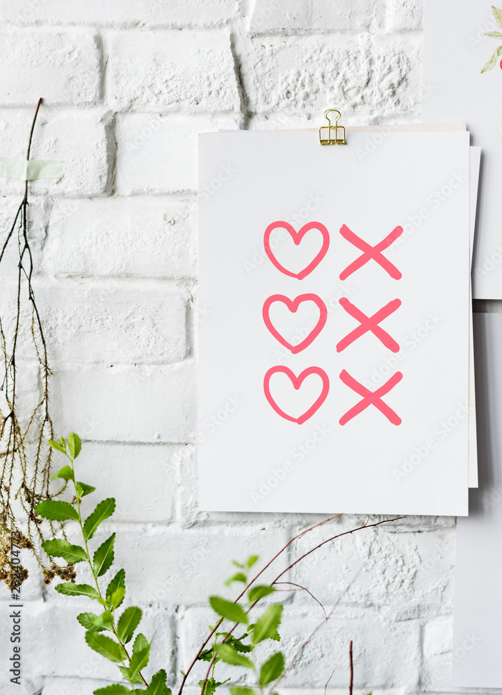 Hearts and kisses symbols poster on white wall