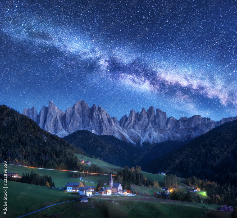 Santa Maddalena and Milky Way at night in autumn in Italy. Starry sky with milky way over St. Magdal