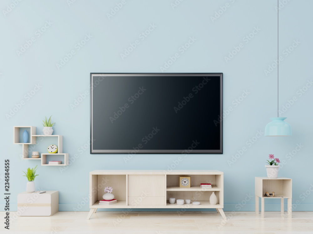 现代客厅橱柜上的电视，蓝色墙背景，3D渲染