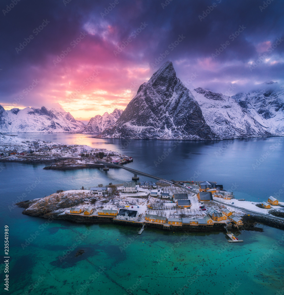 Aerial view of Hamnoy at dramatic sunset in winter in Lofoten islands, Norway. Moody landscape with 