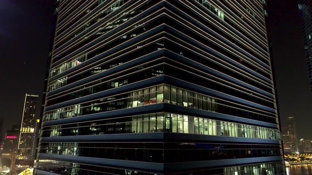 Modern office building at night. Night lights, city office building downtown, cityscape view. Shot. Corporation office buildings at night. Late working