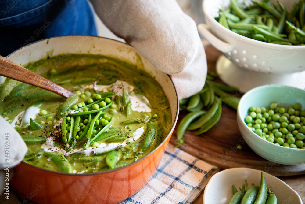 Close up of a green pea soup in a pot