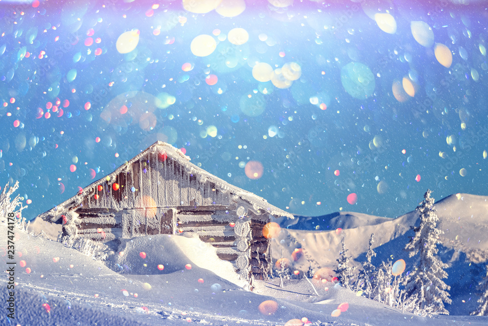 Fantastic winter landscape with wooden house in snowy mountains. Christmas holiday postcard collage.