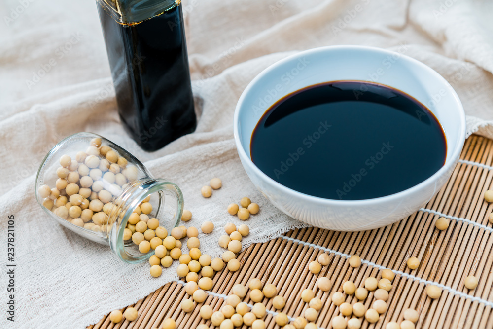 A bowl of soy sauce and sprinkled soybeans	