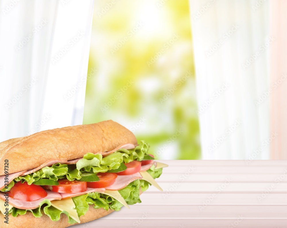 Ham and cheese salad submarine sandwich from freshly cut