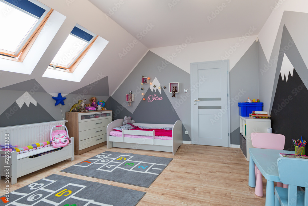 Modern bedroom for boy and girl with furnitures and toys