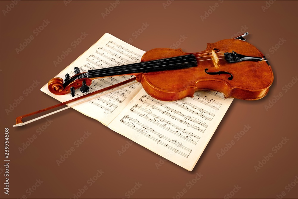 小提琴和音符特写照片