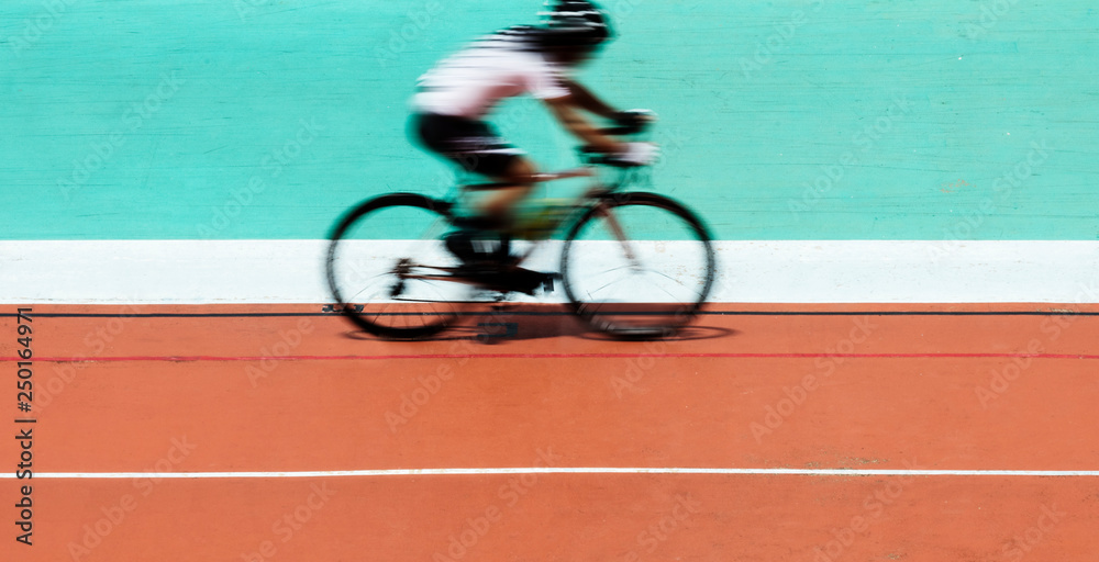 Cyclist biking at a stadium