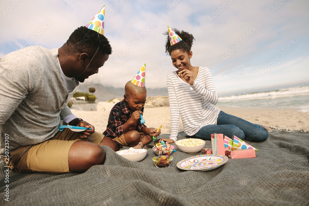 Beautiful family having party at the beach