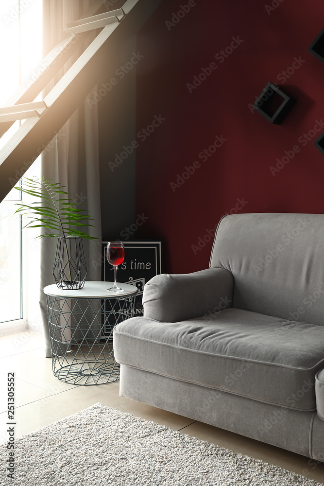 Big sofa in stylish interior of room