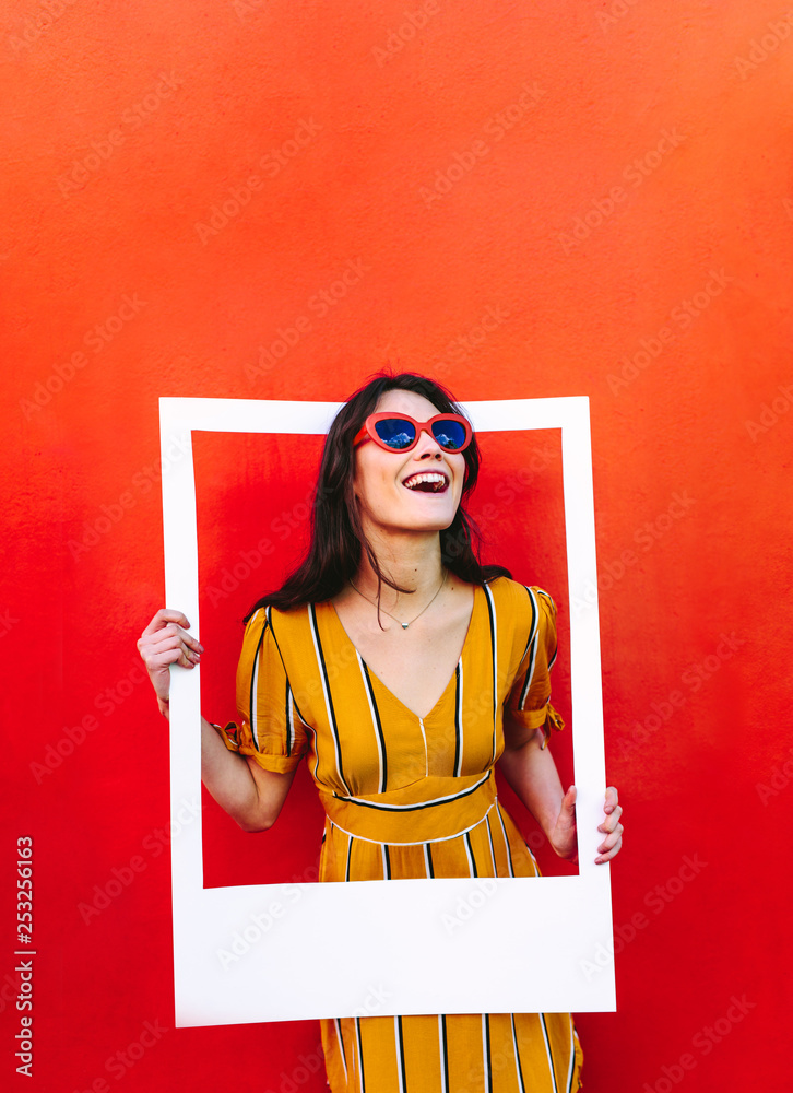 Stylish woman with large photo frame