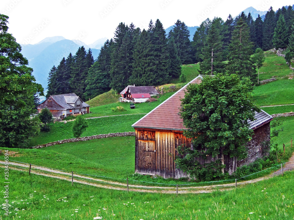 Rural traditional architecture and livestock farms on the slopes of Alpstein mountain range and in t