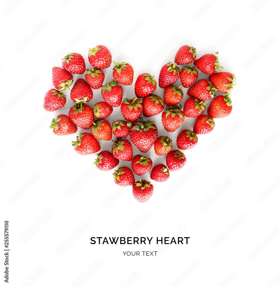 Creative layout made of strawberries in the shape of heart . Food concept. Strawberry on the white b