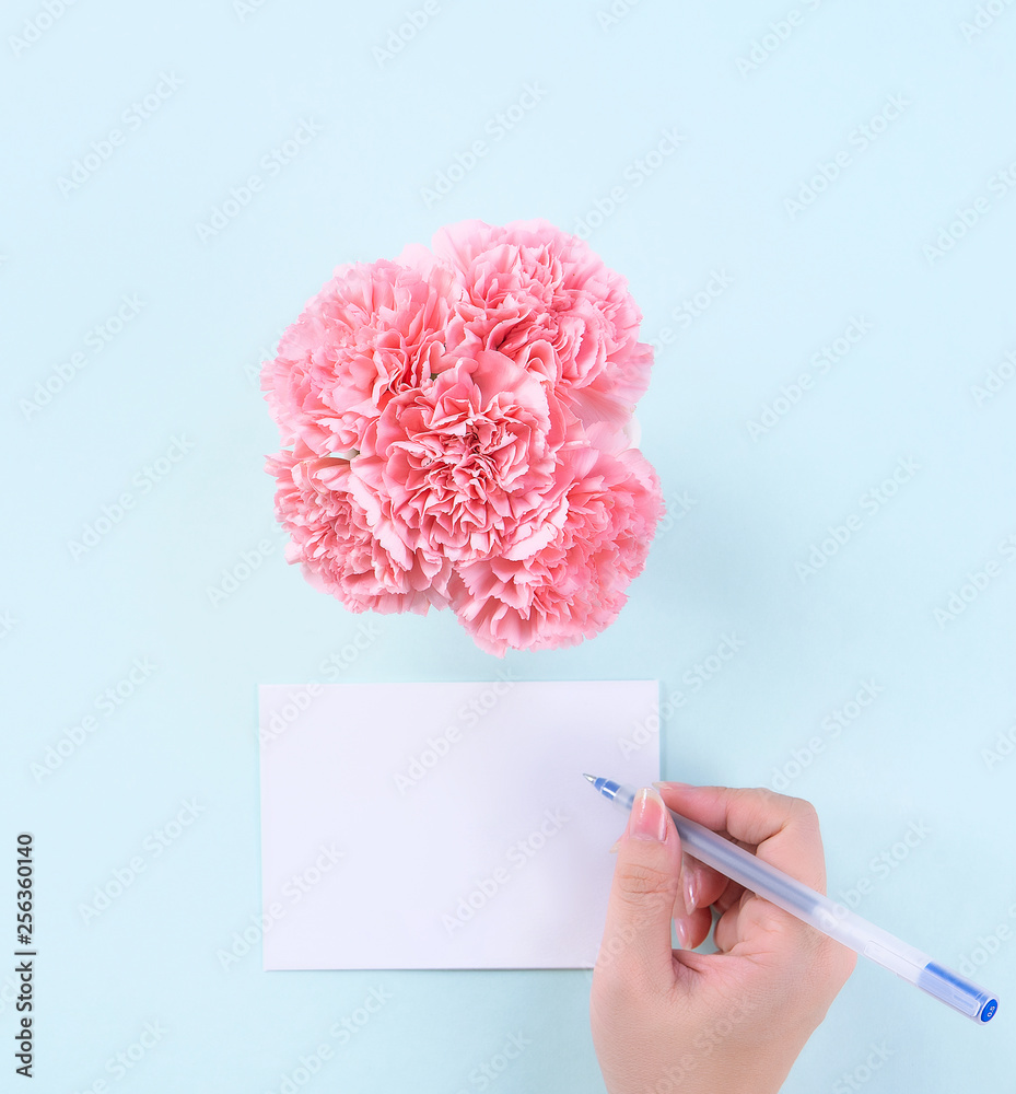 Handwritten greeting card by young teenage person isolated with pale blue background, idea concept o