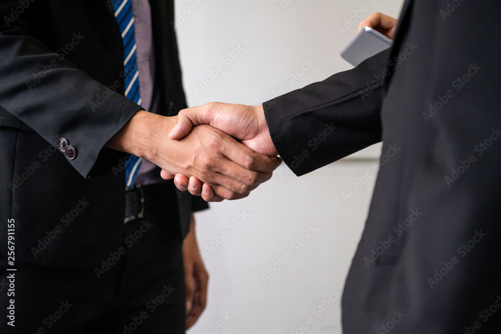 Business people agreement concept. Businessman do handshake with another businessman in the office m