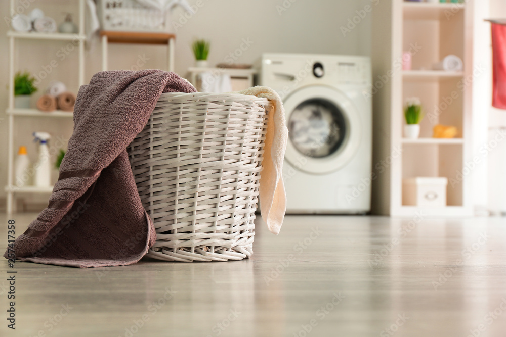 Basket with laundry in room