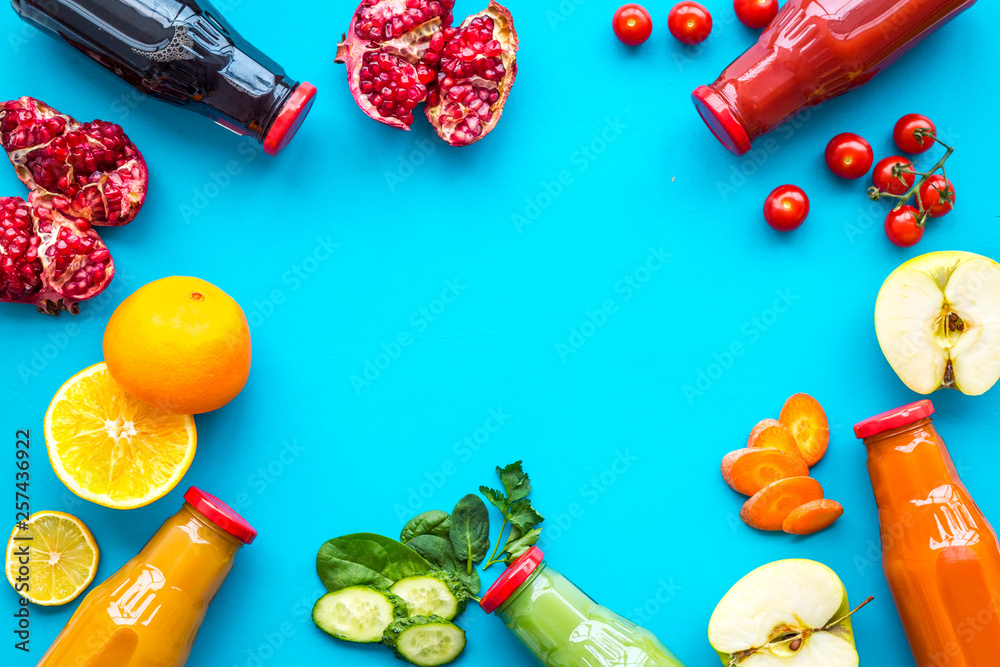 vegetable and fruit juice in bottles for diet drink on blue background top view mock up