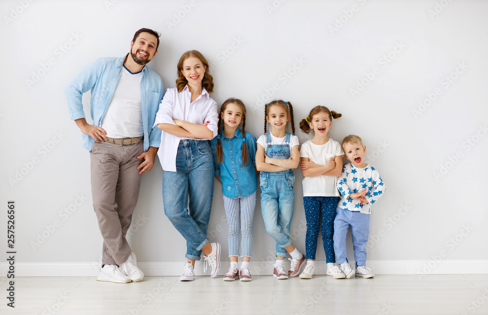 large family mother father and children sons and daughters on white background.