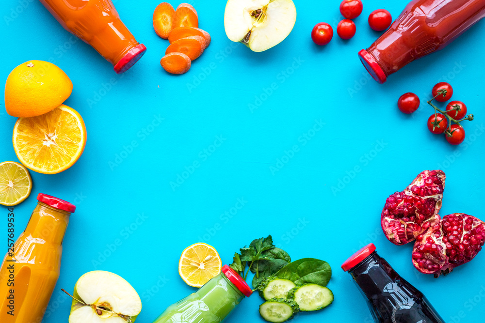 fresh organic juices in bottles for fitness diet on blue background top view mock-up