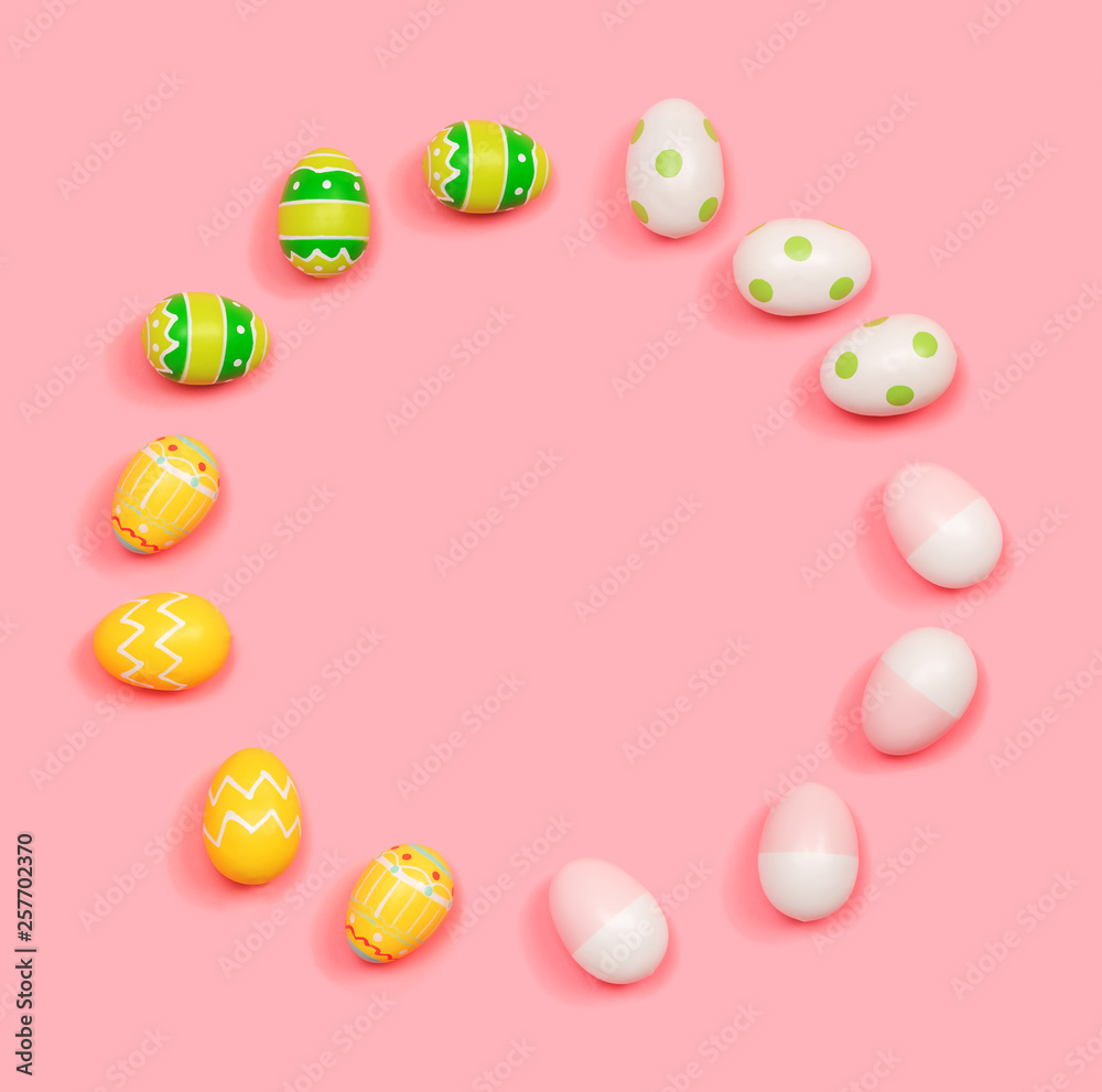 Round frame of Easter eggs overhead view flat lay