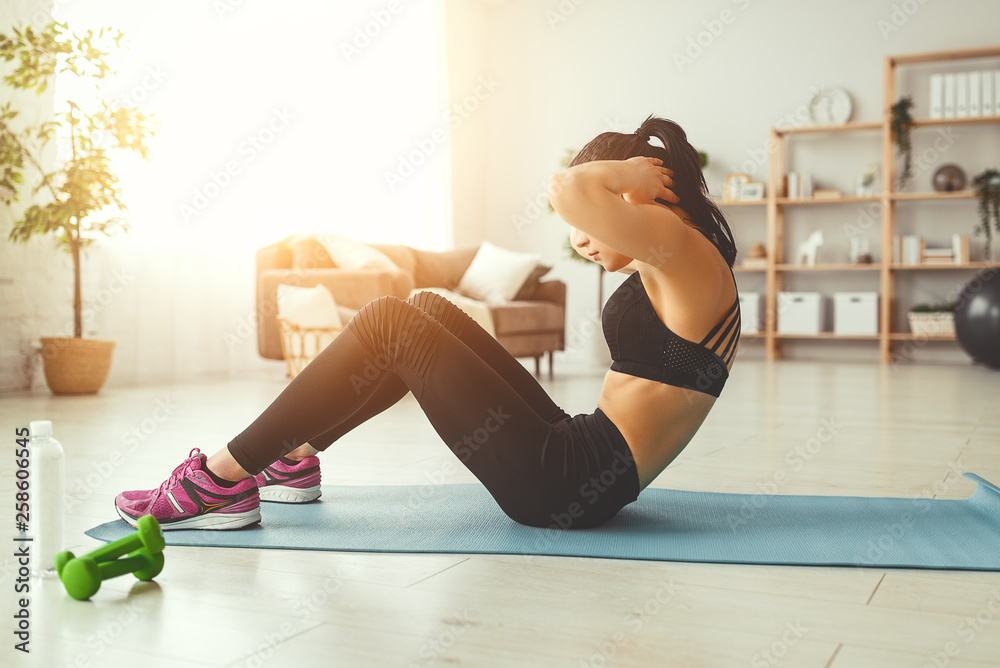  young woman doing fitness and sports at home    .