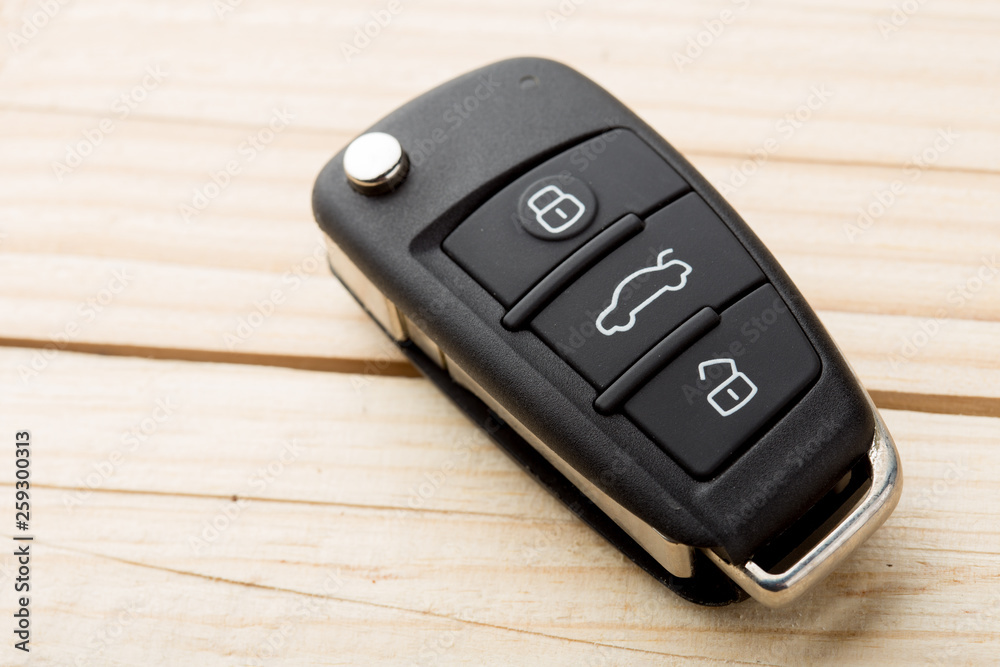 Car key and security remote on the table, concept for rent or buy a new car