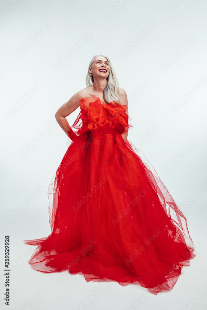 Beautiful mid adult woman in red dress
